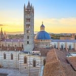 Siena sunset panoramic view. Cathedral Duomo landmark. Tuscany,