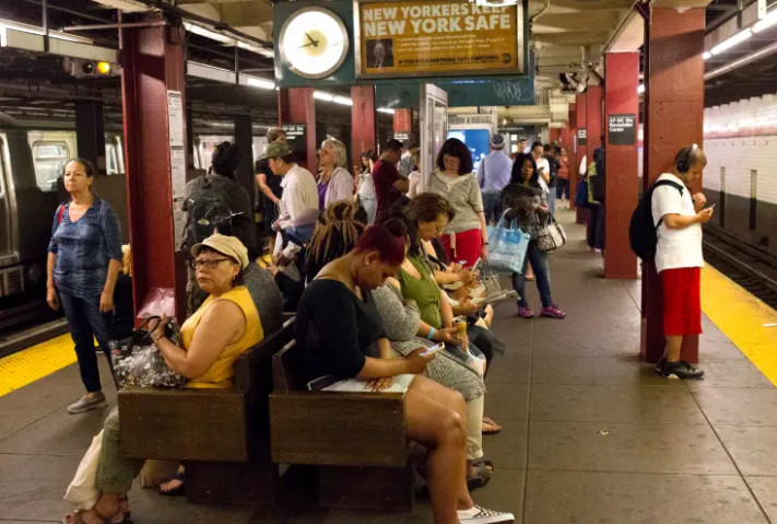 NYC subway station safety overview showing tourists and locals