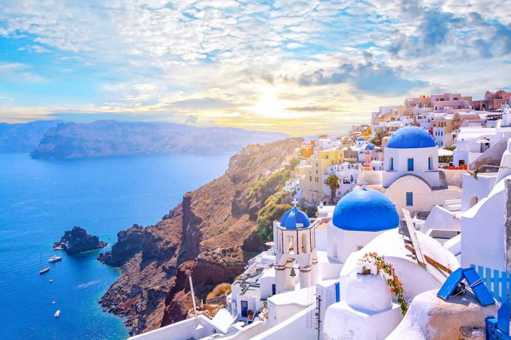 Santorini Greece caldera view with whitewashed houses โ travel guide on tap water safety.